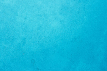 Blue light concrete texture for background in summer wallpaper. Cyan cement colour sand wall of tone vintage. Abstract teal dark color.
