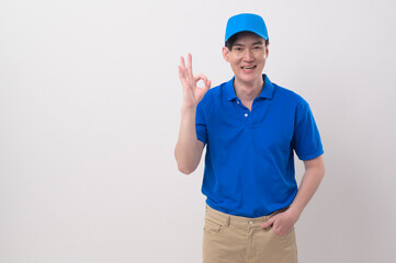 An Asian young Technician service man wearing blue uniform on white background studio