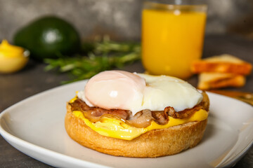 Plate with tasty egg Benedict on table, closeup