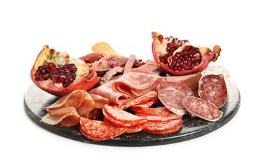 Slate plate with assortment of tasty deli meats isolated on white background