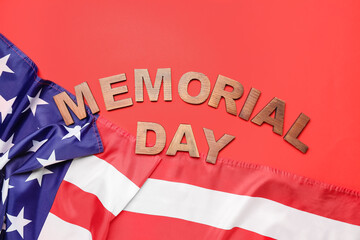 Fototapeta na wymiar Text MEMORIAL DAY with USA flag on red background