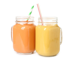 Mason jars of different tasty smoothie with straws on white background