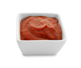 Bowl with tasty tomato paste on white background