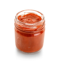 Jar with tasty tomato paste on white background