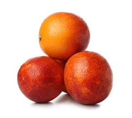 Whole tasty blood oranges on white background
