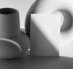 Blank paper mockup template, modern vasen and sunlight shadow black and white colors with copy...