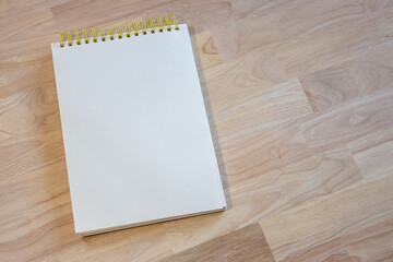 top view image of open notebook with blank pages on wooden table. ready for adding text or mockup. Retro filtered
