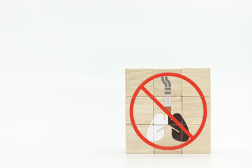 cigarette and lungs icons on wooden cube. World No Tobacco Day.