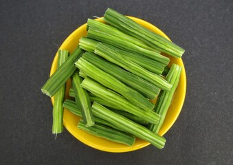 Moringa oleifera or drumstick sliced on a plate 