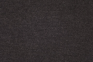 Fabric black knitted close-up, background wallpaper, uniform texture pattern