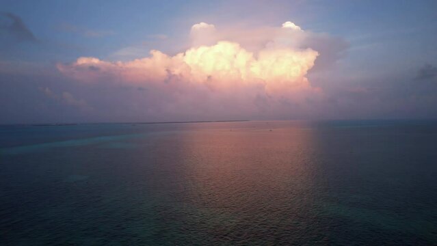 Sunset fly over the waters of the Gulf of Mexico. Located in Cancun, Mexico. Aerial 4K drone video