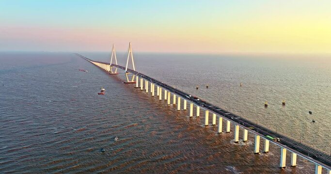Aerial view of Hangzhou Bay Bridge scenery at sunset, Zhejiang Province, China. The total length of the bridge is 36 kilometers. The design speed is 100 kilometers per hour.