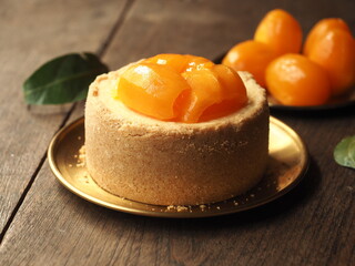 fresh Mayongchid, Plango or sweet Marian plum on top of cheesecake