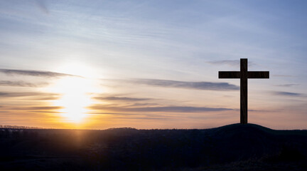Cross. Crucifixion on the mountain on the background of the sunset sky. Forgiveness of sins and repentance. God's love. The death of Jesus