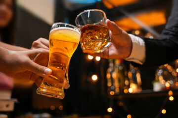 food and drink male friends are happy drinking beer and clinking glasses at a bar or pub.