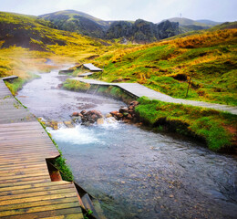 Iceland thermal spring river, hot bath in river