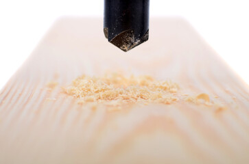 Drilling hole in wood, countersink drill bit in use.