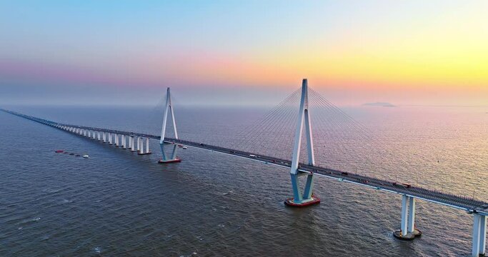 Aerial view of Hangzhou Bay Bridge scenery at sunset, Zhejiang Province, China. The total length of the bridge is 36 kilometers. The design speed is 100 kilometers per hour. 