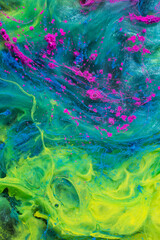 Fototapeta na wymiar Photo of beautiful mixtures of colorful substances in the deep space. Abstract texture of colorful splashes. Expressive swirls.
