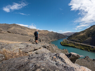 Fototapeta premium Hiker in the mountains near Queenstown New Zealand