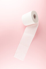 Tissue or toilet paper foroll on pink background with copy space wiping clean. Flat lay and top view image.