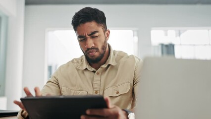 Laptop, tablet and stress with a business man in his office, working on a project or proposal. Computer, internet and confused with a creative male employee doing an online search for info at work