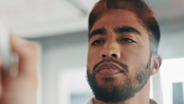 Serious man writing on glass for business ideas, planning or financial management, profit and budget solution. Focused indian person, brainstorming finance strategy and startup company in mindmap