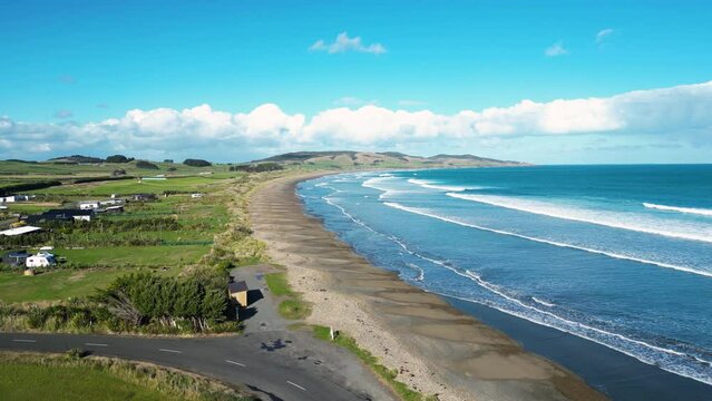 aerial view of Colac Bay  Ōraka small township on the bay  facing Foveaux Strait,  located on the Southern Scenic Route, 10 minutes from Riverton, New Zealand