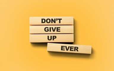 Do Not Give Up Ever Text On Wooden Blocks Isolated On Light Orange Background, 3d illustration