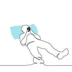 man lies in bed with his head on pillows and a phone in his hands - one line drawing vector. concept internet addiction, addiction to social networks