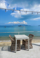 Table and chairs on the beach, Koh Samui, Thailand.