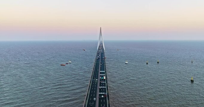 Aerial view of Hangzhou Bay Bridge scenery at sunset, Zhejiang Province, China. The total length of the bridge is 36 kilometers. The design speed is 100 kilometers per hour.