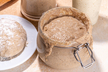 Active homemade sourdough in jars