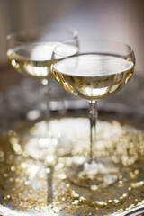 Glass of champagne with golden stars