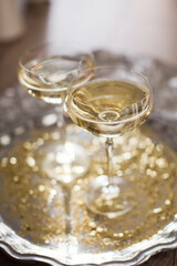 Glass of champagne with golden stars