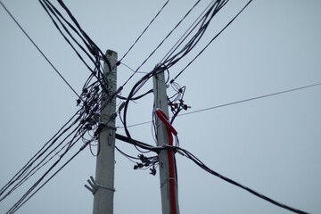 Pole with wires. Electrical wires in details. Concrete pole.