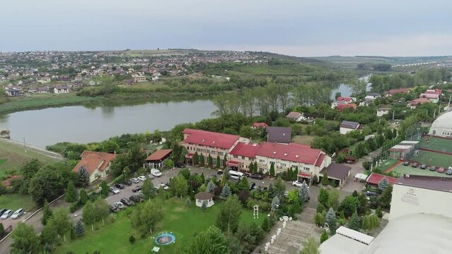 Drone view zooming out on Iasi, Romania.  Wedding resort with a tranquil park and beautiful Lake Lezareni situated behind the resort.