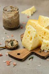 cheese with holes and truffle paste. Food recipe background. Close up