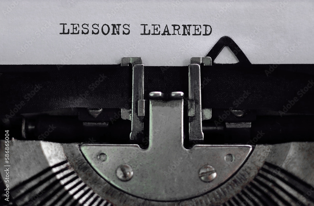 Poster text lessons learned typed on retro typewriter