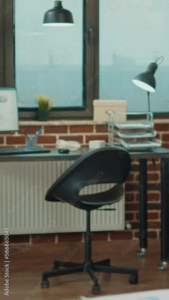 Poster vertical video: empty coworking space with documents on boardroom table, company development plan wi