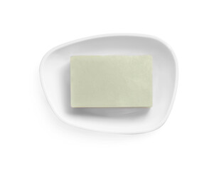 Holder with soap bar on white background, top view