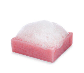 Soap bar with fluffy foam on white background