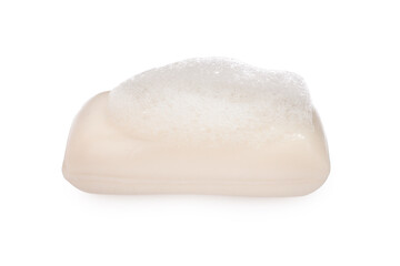 Soap bar with fluffy foam on white background