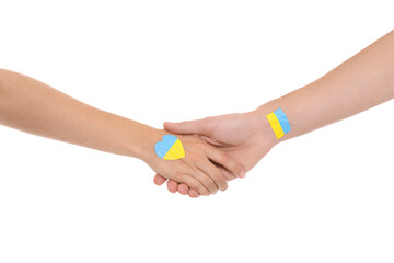 Man and woman with painted Ukrainian flags on their hands against white background, closeup