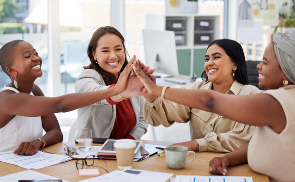 Teamwork, business women and high five in office for team building, motivation and collaboration. Cooperation, celebration and group of happy people or staff celebrating goals, success or achievement