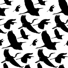 A pattern with flying black silhouettes of birds. The outline of storks in a repeating pattern for printing on textiles and paper. Free print with birds on a white background. Elements for tattoos