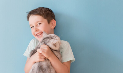 Child and cat on blue background