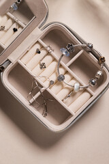 Jewelry box with white gold, silver and diamonds. Top view.