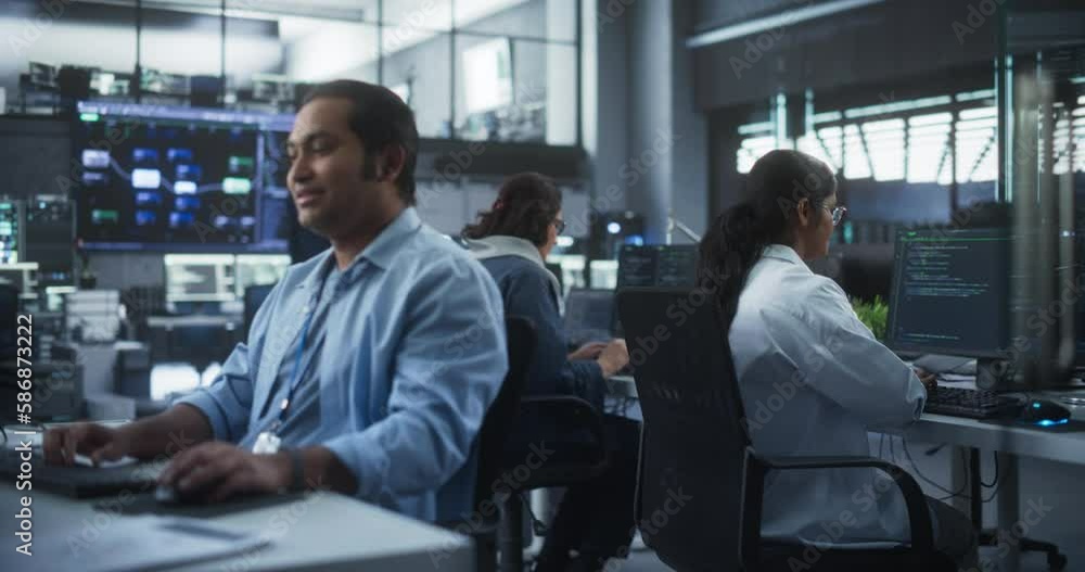 Leinwandbilder Creative Team of Indian Specialists Having a Conversation at a Workplace Next to Computer. Two Male Software Engineers Discussing a Software Code for Their Digital Blockchain Development Project