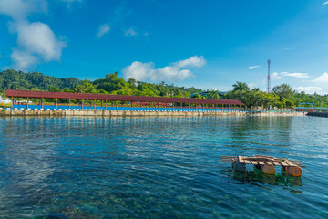 The pier with the signn Pelabuhan - harbor- Raja Ampat of Waisai at Raja Ampat islands, West Papua